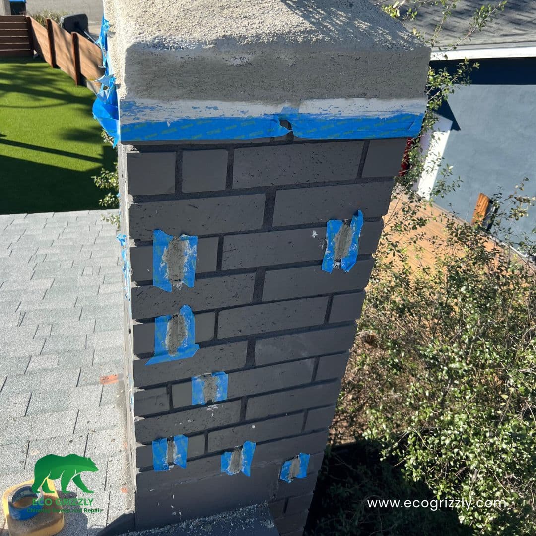 Exterior chimney repairs identified and marked following a thorough inspection