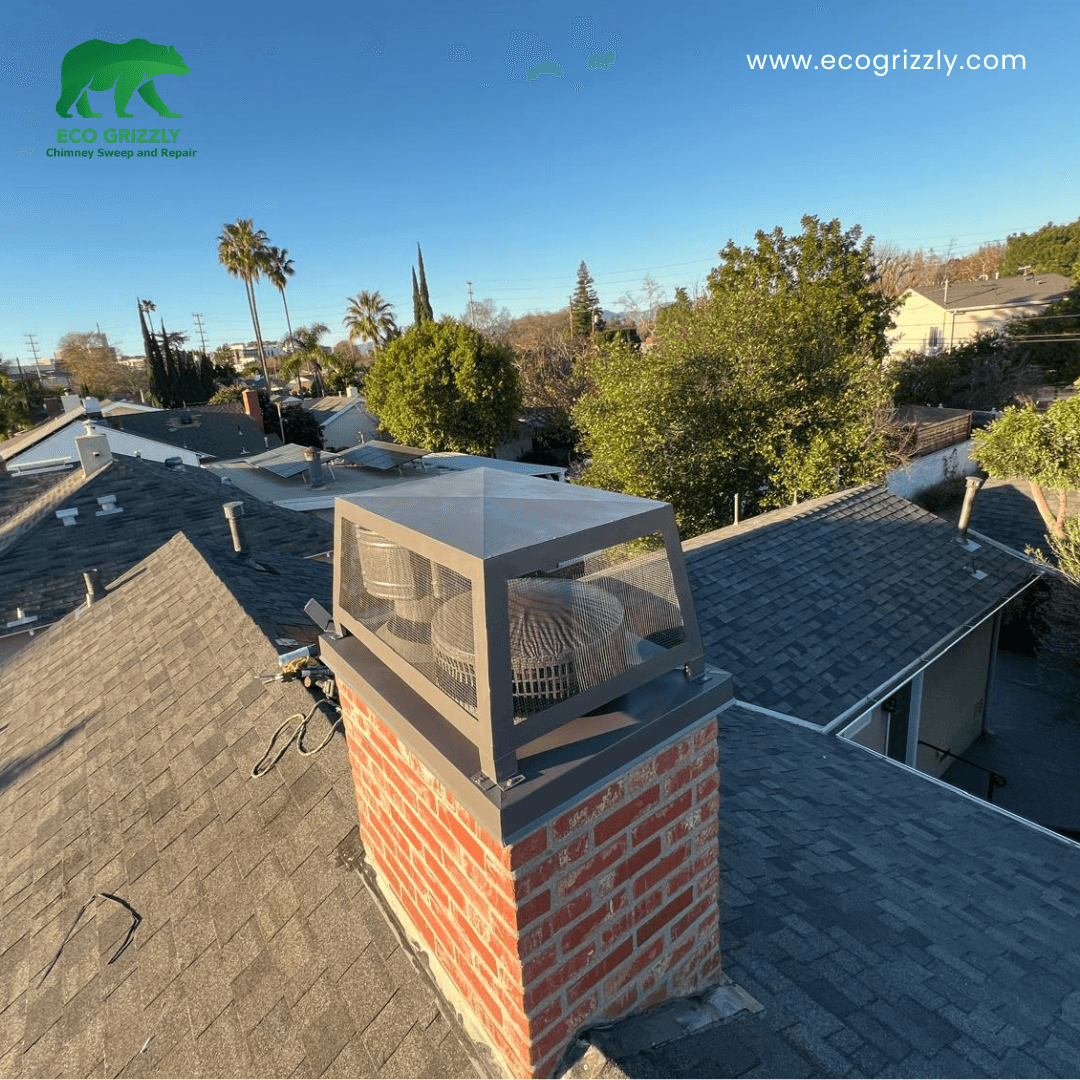 Decorative chimney shroud installed over the flue opening on a residential rooftop