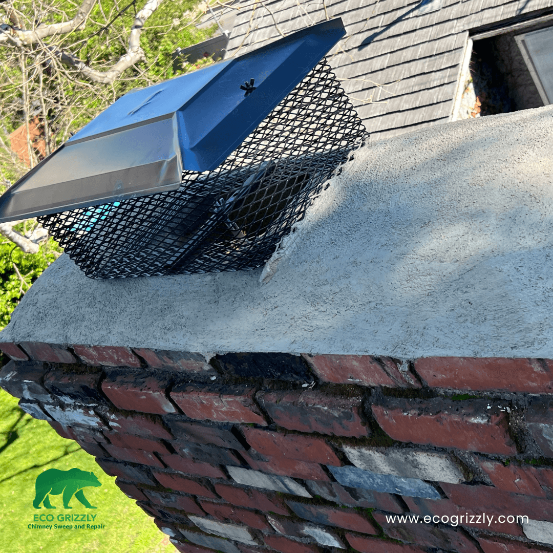 Galvanized chimney cap installed on a masonry chimney in Southern California