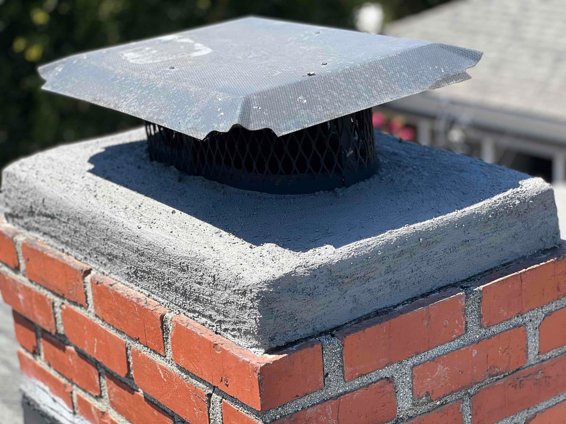 Chimney crown after professional resurfacing with cracks fully repaired