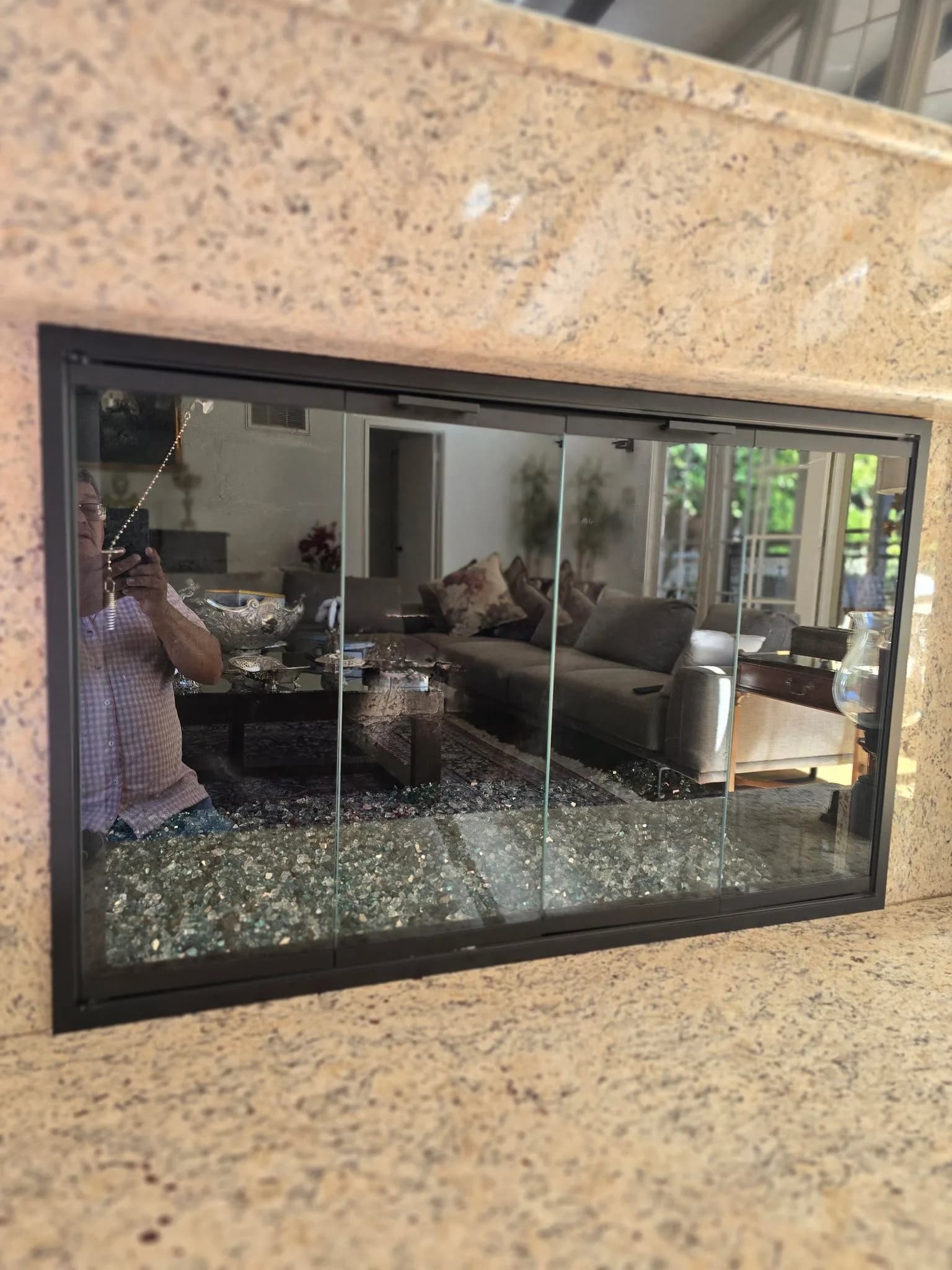 Fireplace glass door hardware and lintel clamps secured during installation