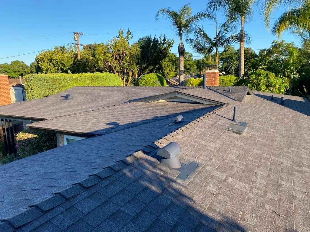 Completed roof replacement with new shingles and clean finish