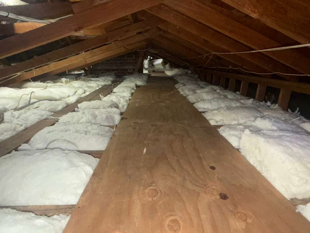 Completed attic insulation installation showing full coverage