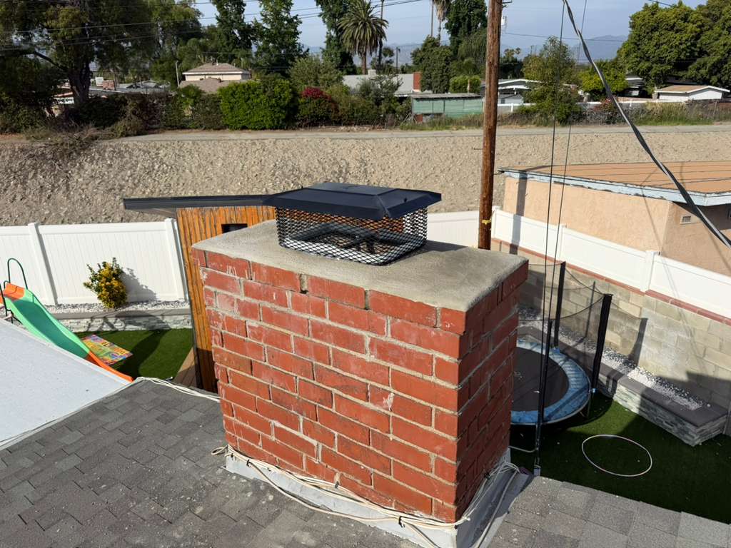 New properly-sized stainless steel chimney cap installed