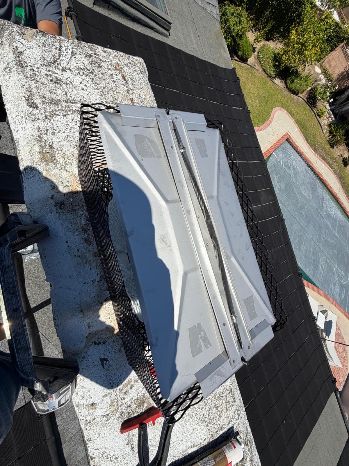 New stainless steel chimney cap and top-sealing damper installed