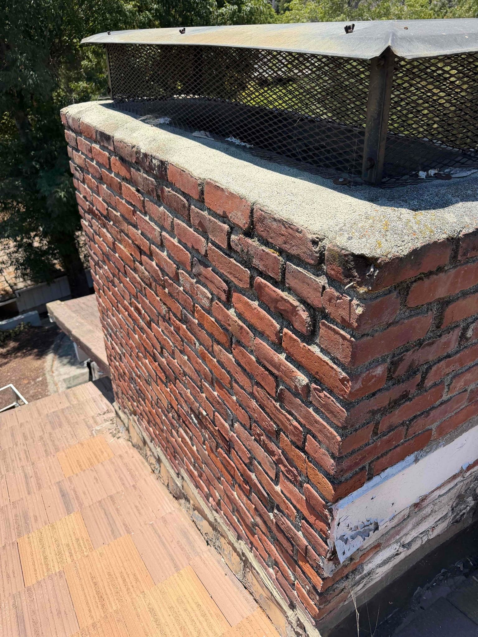 Cracked and deteriorated chimney crown before repair