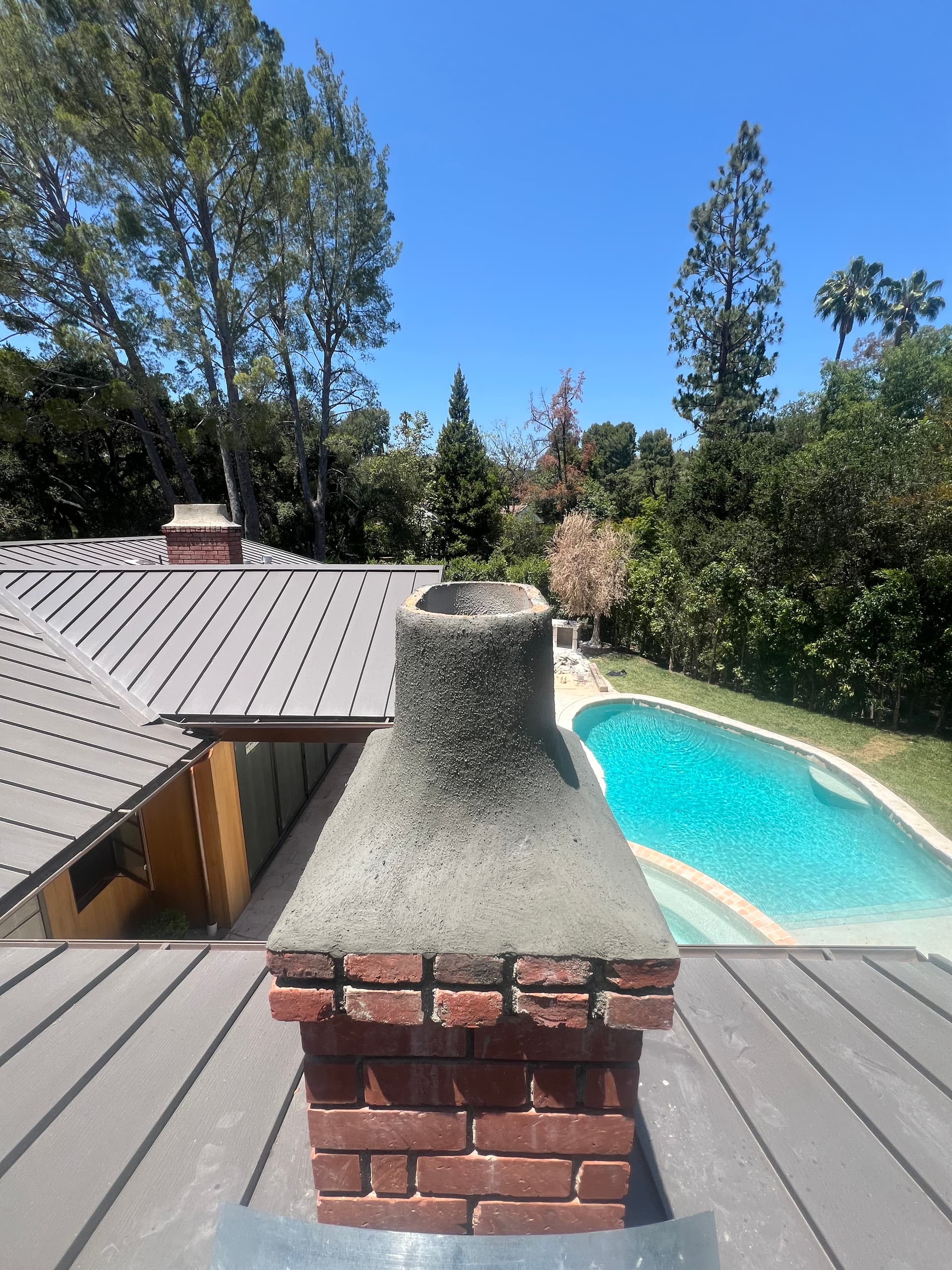 Newly rebuilt and sealed chimney crown after completion