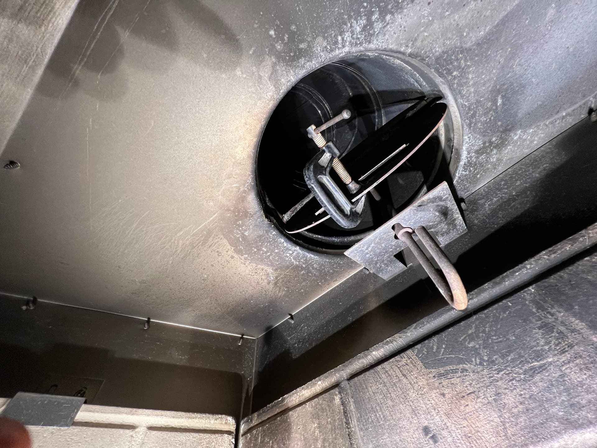 Damper clamp installed to secure broken throat damper closed