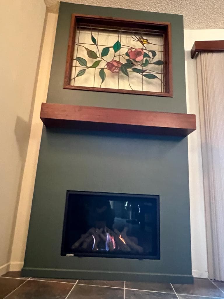 Finished fireplace insert and remodel viewed from a second angle in the living room