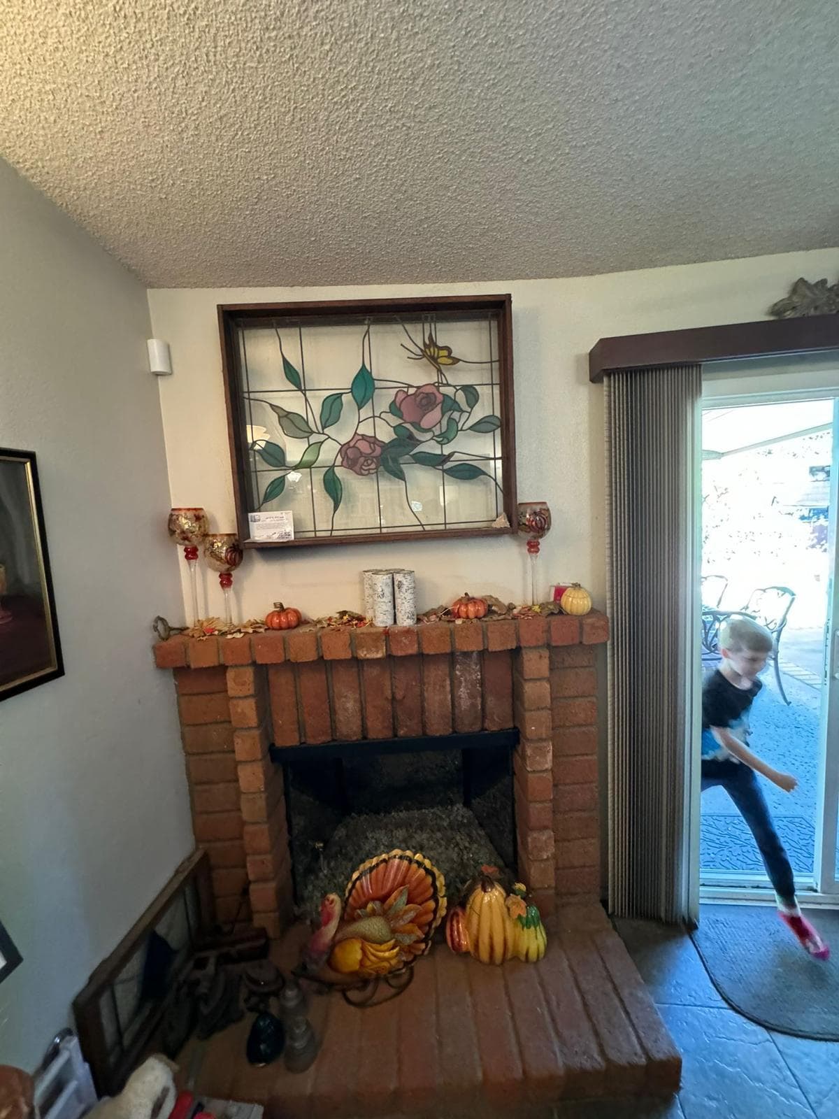 Fireplace before insert installation and remodel showing the original firebox and surround