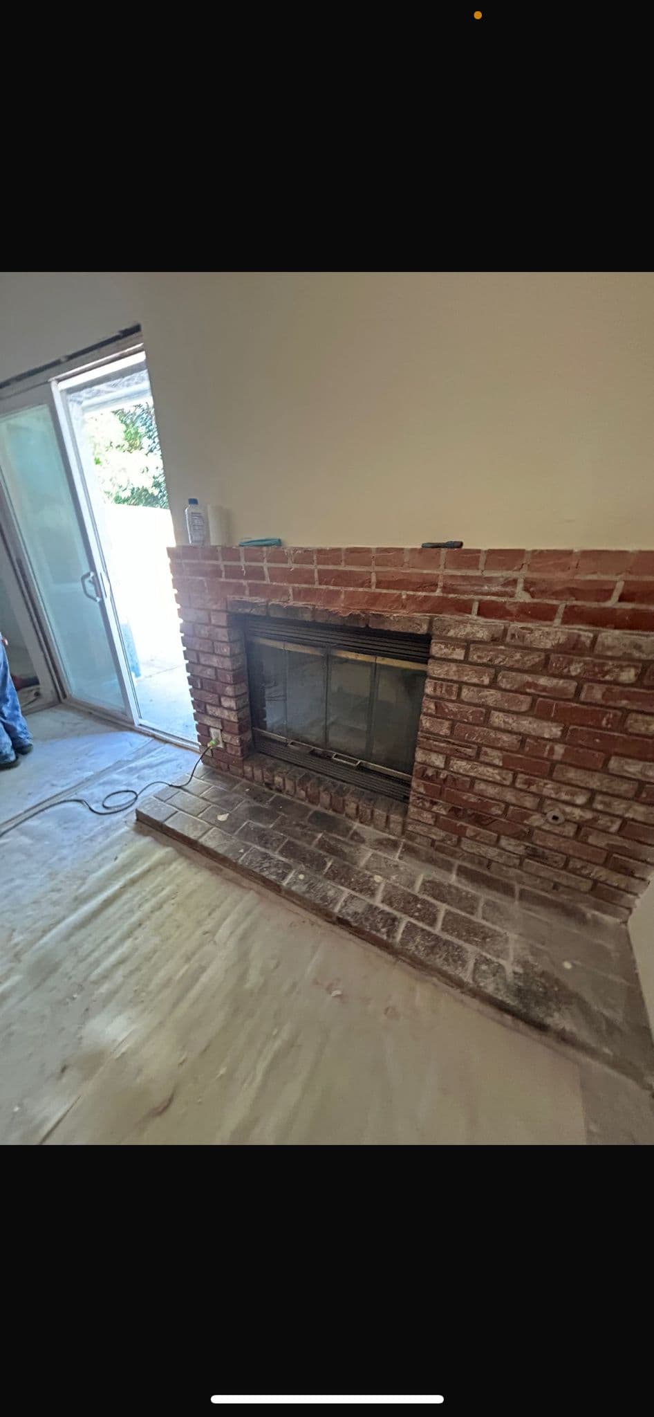 Living room before electric fireplace installation showing old fireplace unit
