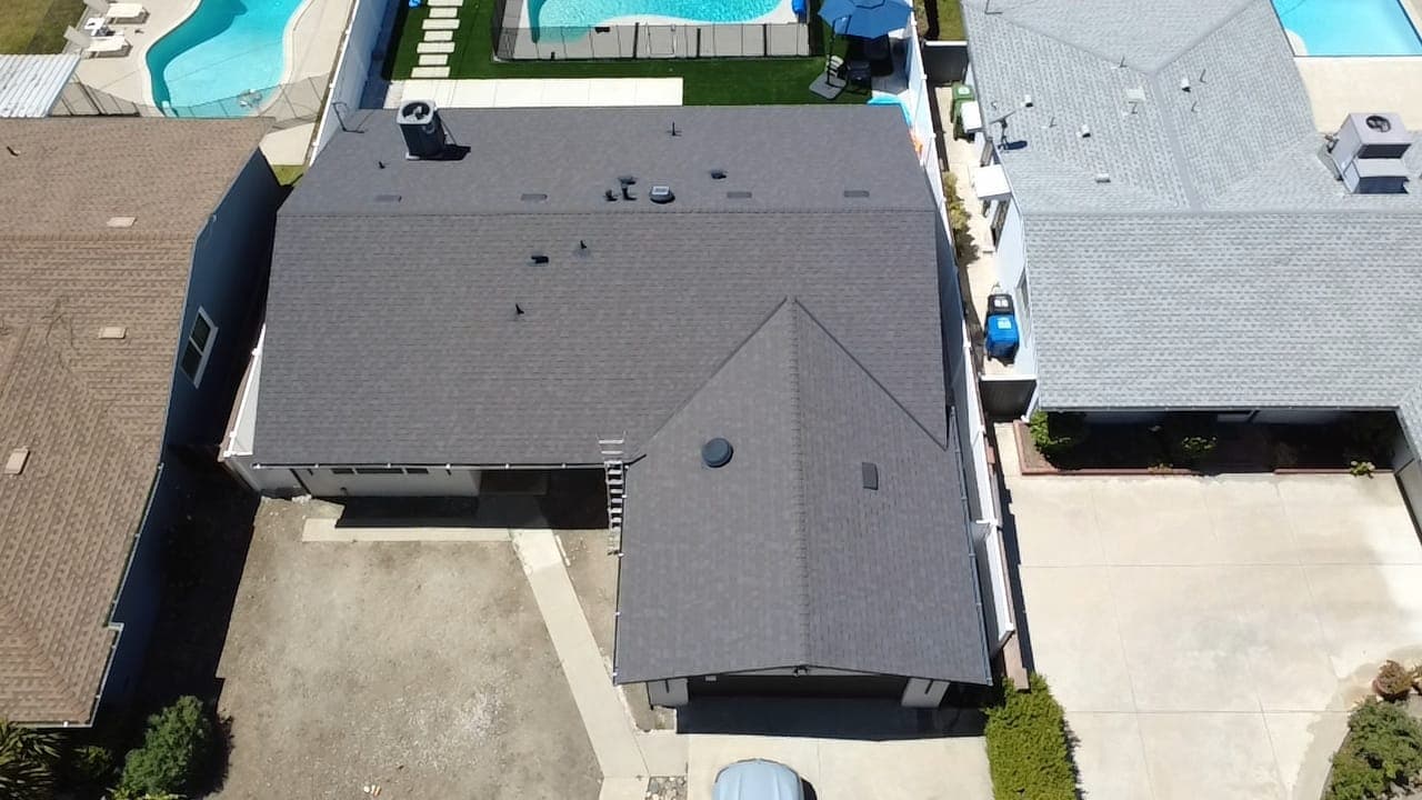 Completed roof replacement with new architectural shingles, view 1