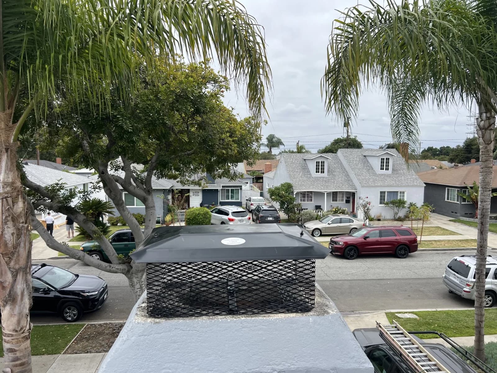Completed custom-sized chimney cap installed on residential chimney flue