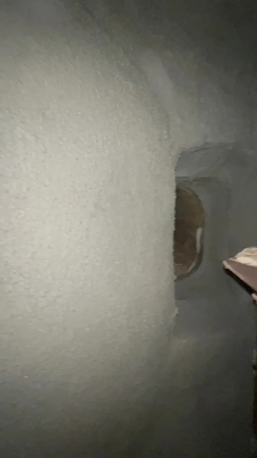 Smoke chamber after parging with Chamber Tech 2000 showing smooth refractory mortar surface