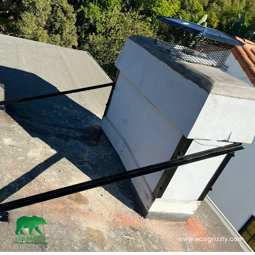 Chimney masonry reinforcement showing fresh mortar and brick stabilization