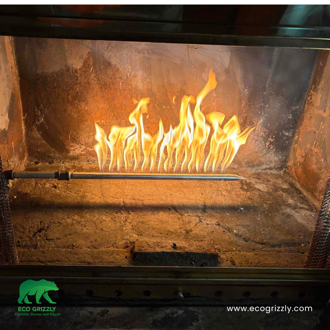 Creosote removal from chimney flue walls during a professional sweep service