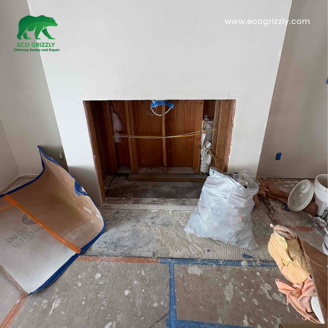 Fireplace before insert installation showing the existing open firebox