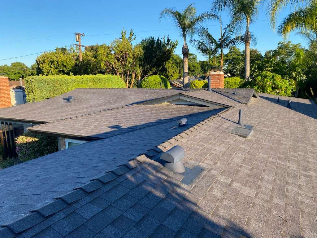 Newly installed roof with fresh architectural shingles